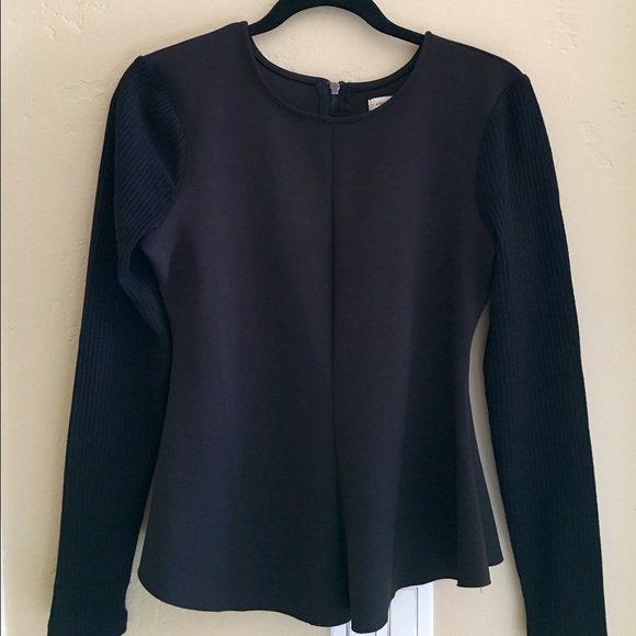 long sleeve black peplum style top