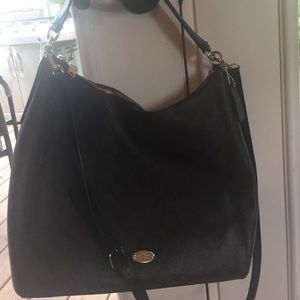 Black and brown slightly used Coach pocketbook