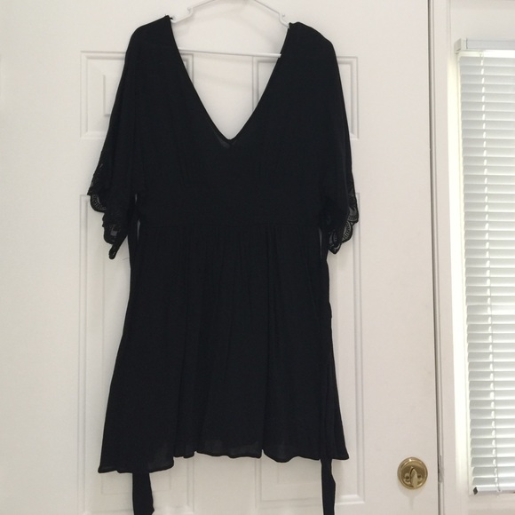 Black dress with lace sleeve detail and tie waist