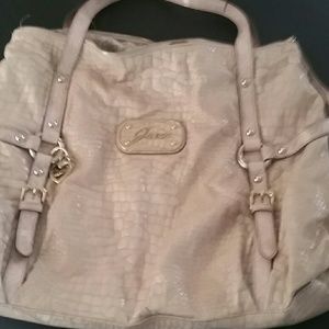 A used pink,large,Guess purse