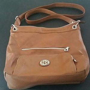 A used brown Relic shoulder purse