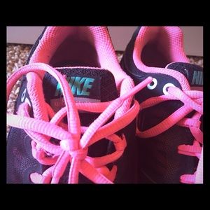 Hot pink and black Nikes