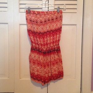 Red, tan, and black strapless romper