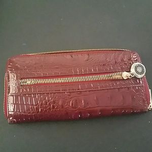 A fairly used burgundy Anne Klein wallet
