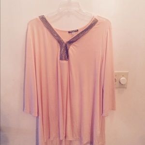 Pink flowy blouse with embellished neckline