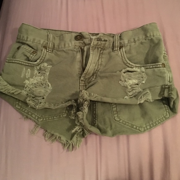 Green distressed shorts