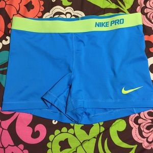 Turquoise and lime green Nike pros