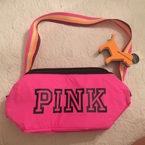 Pink cooler with mini dog keychain.