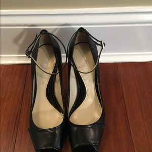 Enzo Angiolini black peep toe pumps with strap.
