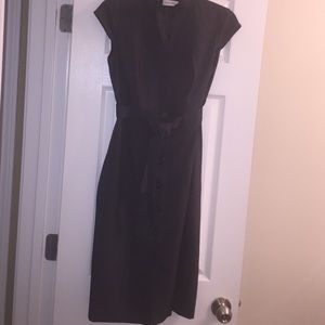 A dark grey, long, Calvin Klein dress