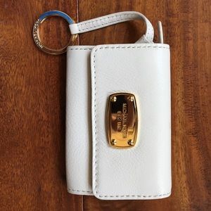 Cream colored Michael Kors small wallet.