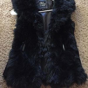 Black fur vest with hood-like flap