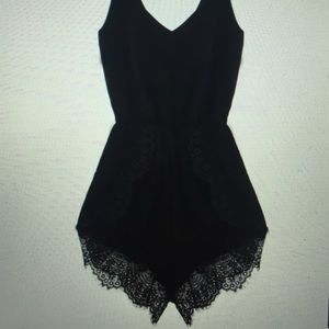 Black V-neck Romper with Lace Detailing