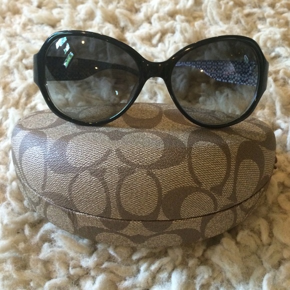 Coach black sunglasses with white daiseys.