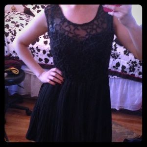 Little black dress. Lace top with pleated skirt