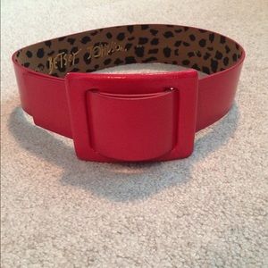 Bright red belt with large buckle