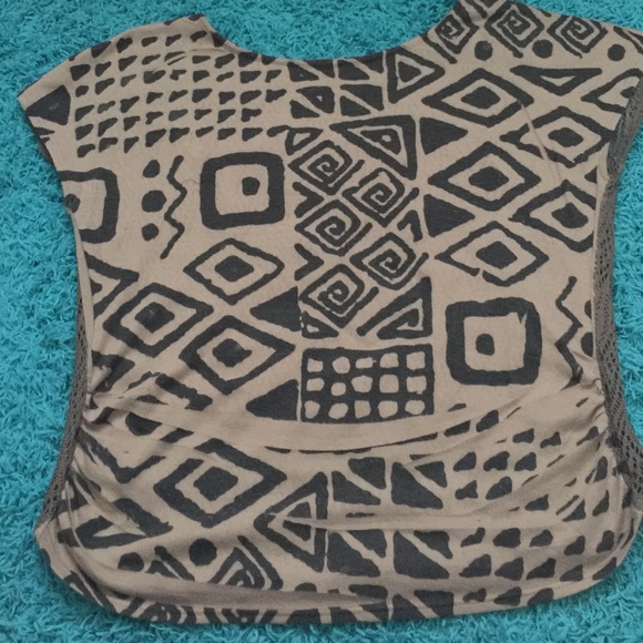 Brown patterned shirt with lace back.