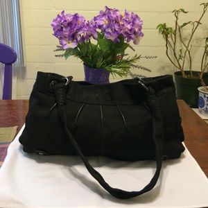 B. Makowsky black suede bag.
