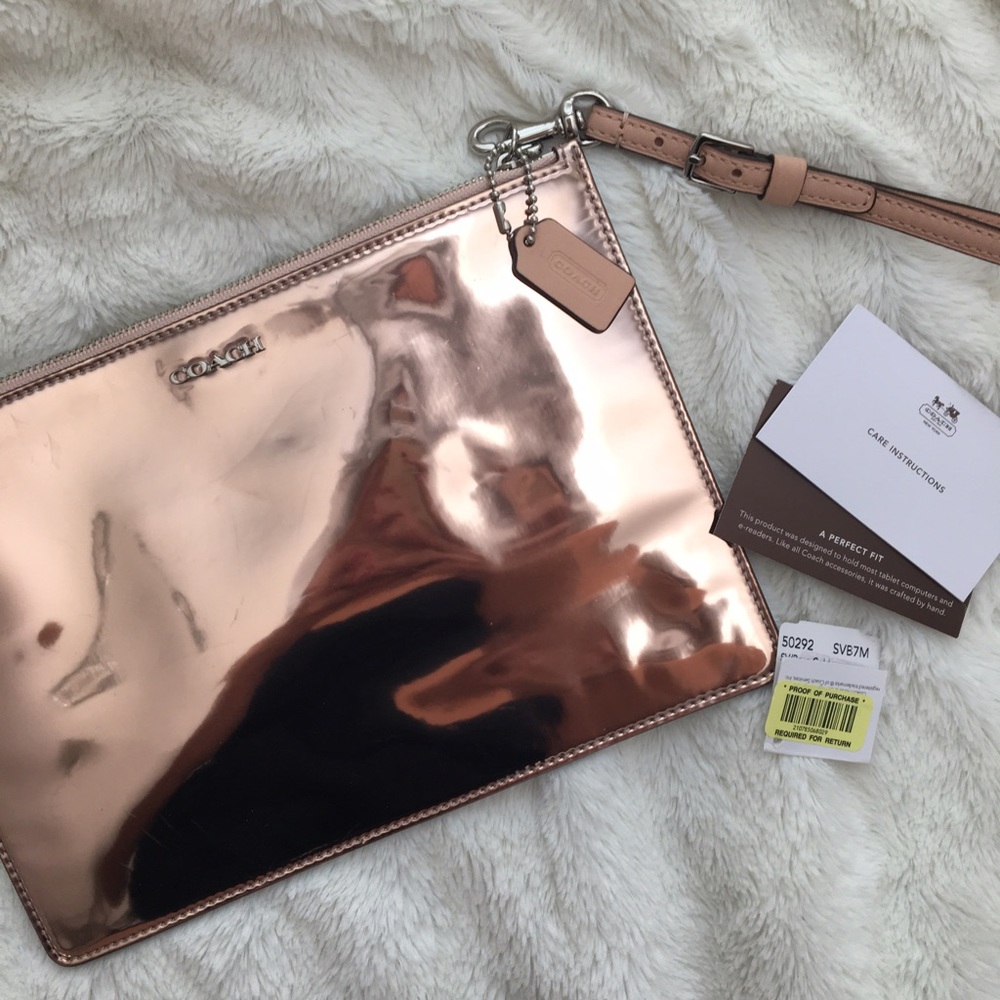 Rose gold Coach clutch