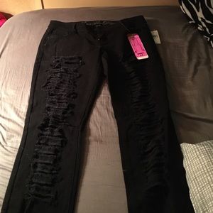 Black distressed jeans.