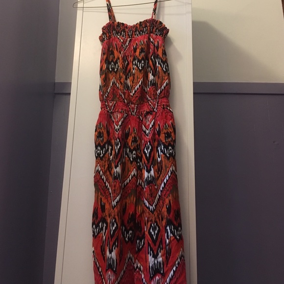 Orange, red, black, and white jumpsuit, size small