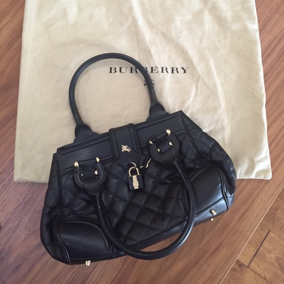 Black leather Burberry purse with dust bag