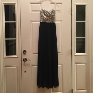 A navy blue and sequin strapless prom dress