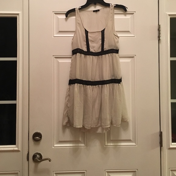 A white with black polka dot sheer dress