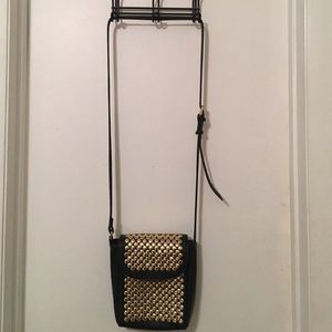 Adjustable black and gold studded shoulder bag