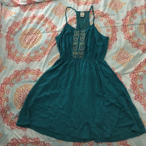 Teal dress with detail on the chest