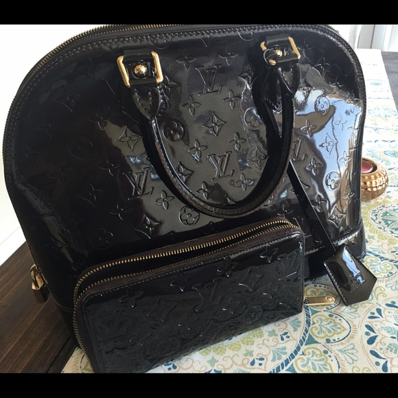 Louis Vuitton Alma PM hand bag. (Burgundy)