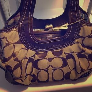 Brown Coach Signature handbag. Priced accordingly.