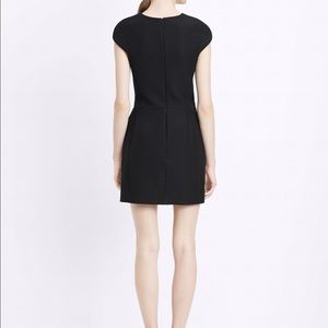 Black inverted front pleat dress