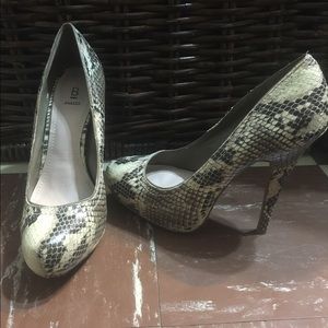 Brown and white snake skin heels