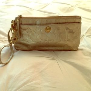 Coach clutch with wrist strap