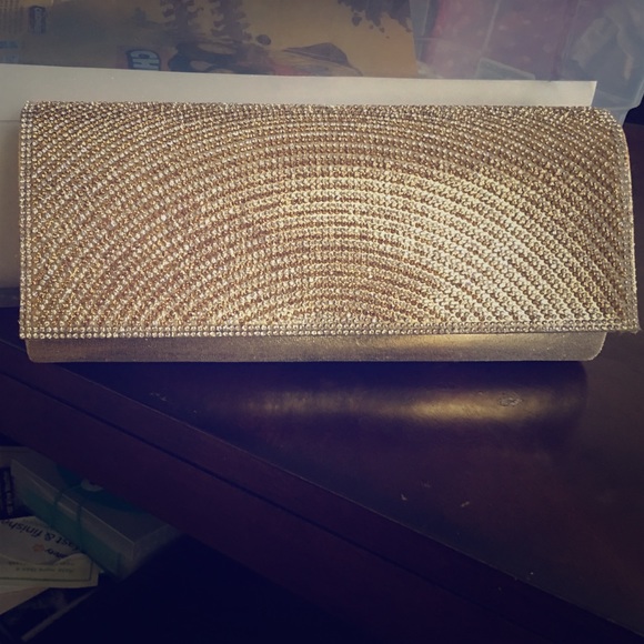 A gold handbag . Only used once