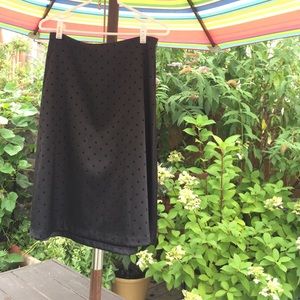 Black satin skirt with delicate polka dots