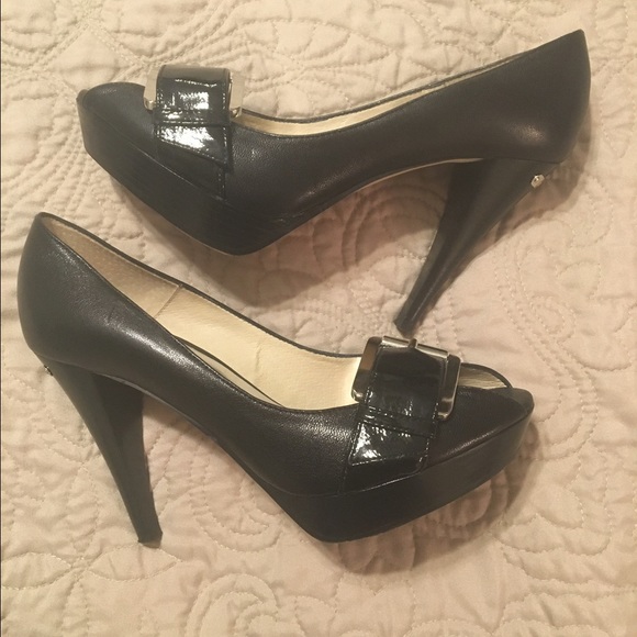 MK heels black with silver buckle.