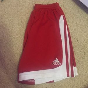 Red and white adidas shorts