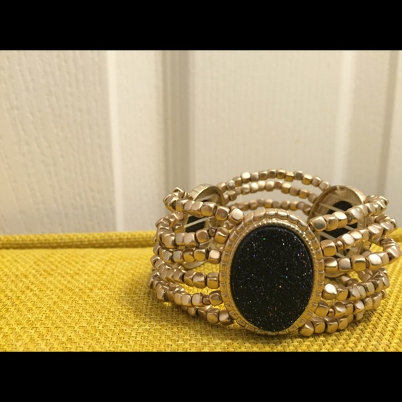Gold colored beads/black stone bracelet
