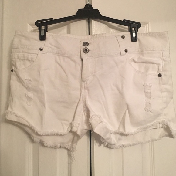 White shorts made with the torn/cut look