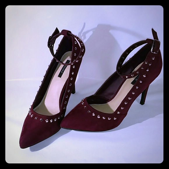 Edgy maroon and gold spiked heels