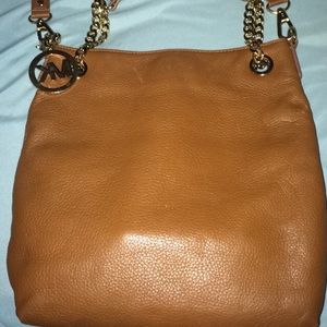 2 MK wallets and 1 MK purse