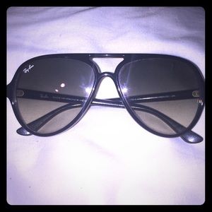 These are a pair of black aviator Ray-Bans.