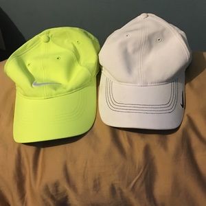 Two Nike hates, lime green and white