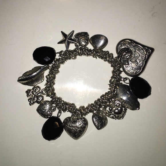 Silver and black charm bracelet. Elastic.
