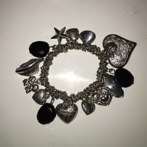 Silver and black charm bracelet. Elastic.