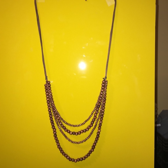 Brown leather and wooden bead necklace.