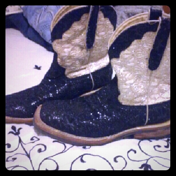 Black and gold ferrini boots.