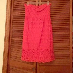 Strapless coral eyelet dress.